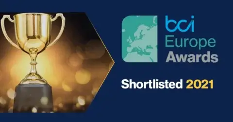 An image showcases a gold trophy on the left amid glowing lights. To the right, text reads "bci Europe Awards Shortlisted 2021." Below, a yellow "Awards" label is paired with the bci logo and tagline. We are pleased to announce that F24 is shortlisted in the innovation category.