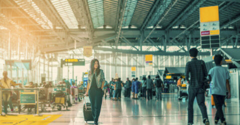 Woman walking through airport