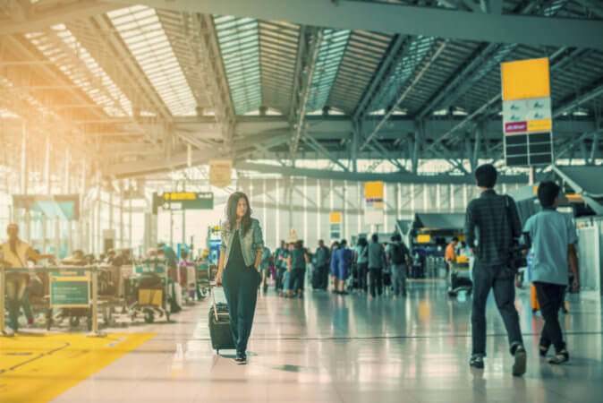 Woman walking through airport