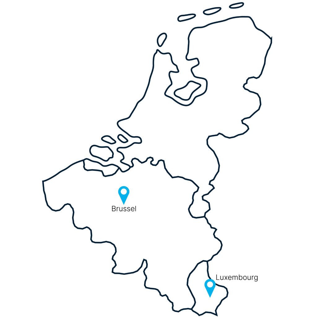 Simple black map outline of the Benelux region—Netherlands and Belgium—with two blue location markers: one near the middle of Belgium labeled "Hasselt," and one in the south labeled "Luxembourg.