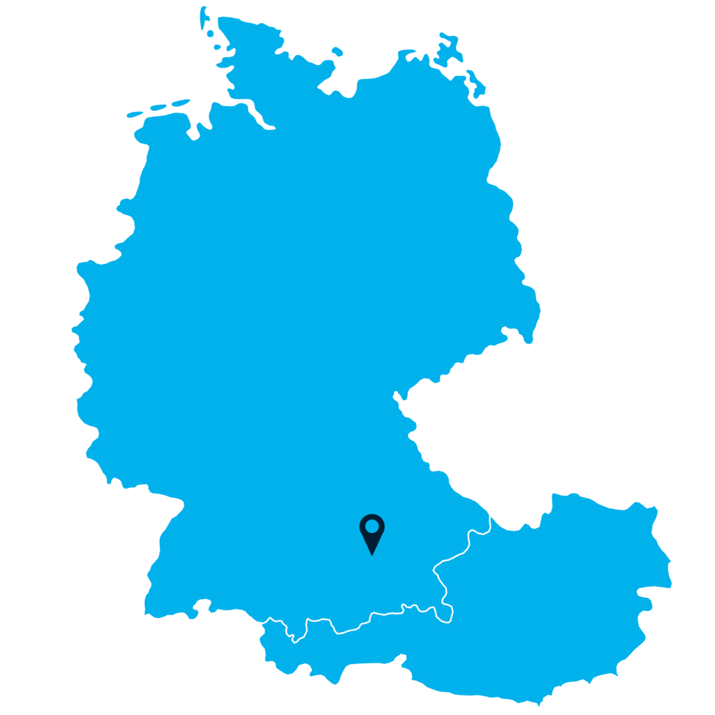 A blue map showing Germany and Austria on a cyan background, with a location pin marking a spot in southern Germany near the Austrian border.