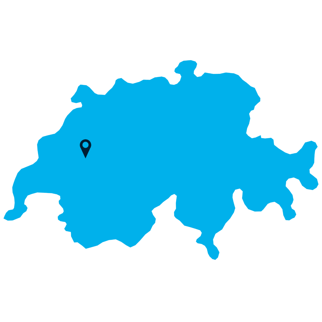 A solid blue silhouette map of Switzerland with a location pin marking a spot in the western part of the country, representing F24 Schweiz AG’s presence.
