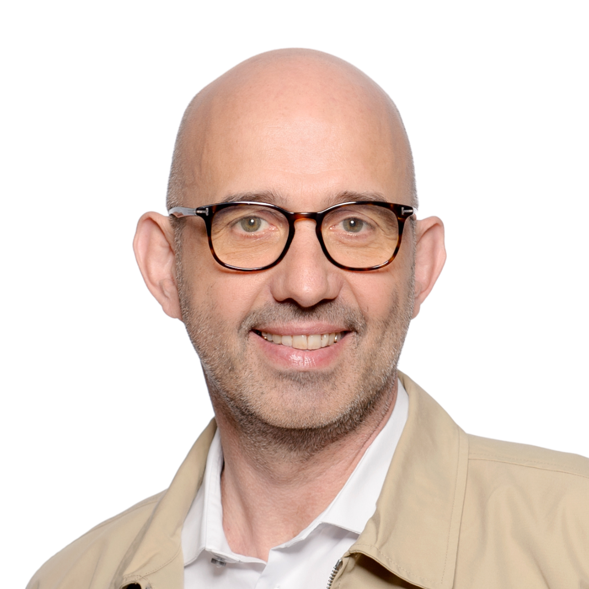 A smiling bald man with glasses and a trimmed beard, wearing a beige jacket over a white shirt, against a plain background.