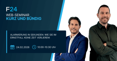 Two men stand side by side, one in a blue suit and the other in a dark shirt, promoting an F24 web seminar titled "Kurz und bündig" about Alarmierung ohne Umwege in emergencies, scheduled for 24.02.2026 from 10:00 to 10:30.