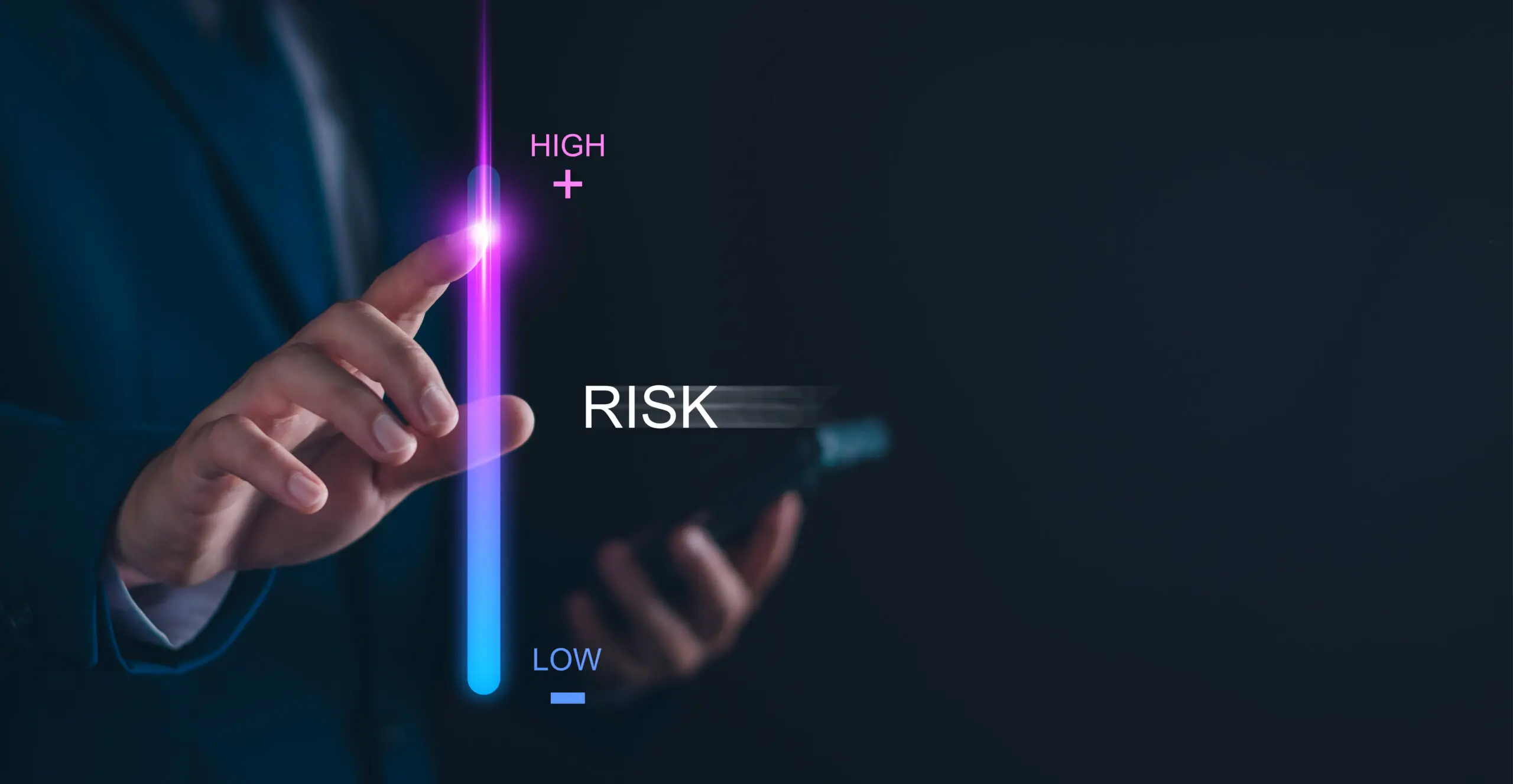A person’s hand touches a glowing vertical bar with "high" at the top and "low" at the bottom, next to the word "risk," suggesting adjustment of risk level—perfect for illustrating a Webinar: Innføring i effektiv kriseledelse on a dark background.