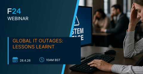 A woman looks stressed at her desk with a “System Outage” message on her computer. Text advertises the F24 ENS+ Webinar titled "Global IT Outages: Lessons Learnt," scheduled for 28.4.26 at 10AM BST.