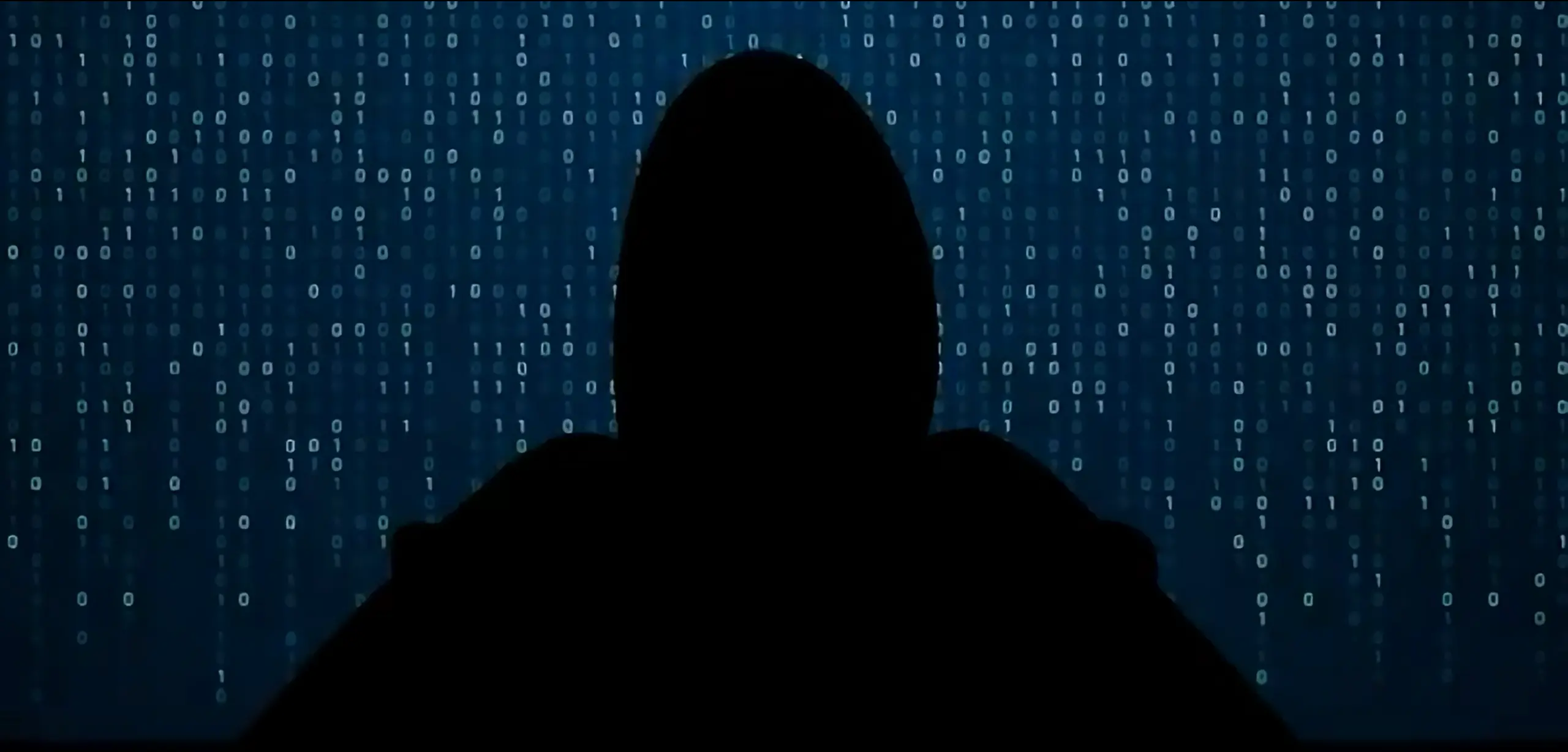 A hooded figure in silhouette sits in front of a blue background filled with binary code, evoking a mysterious, cyber-themed atmosphere that highlights the importance of Réponse aux cyberincidents.